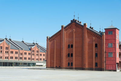 Exterior of buildings against clear blue sky