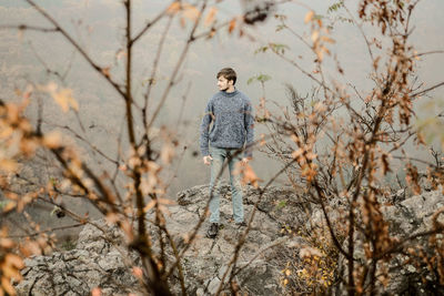 Portrait of man on rock