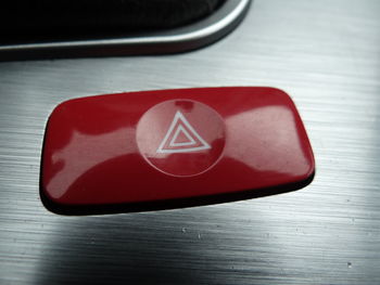 High angle view of red telephone on table