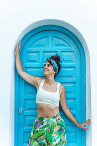 Vertical view of woman breathing fresh air on holidays. travel and summer destination in spain.