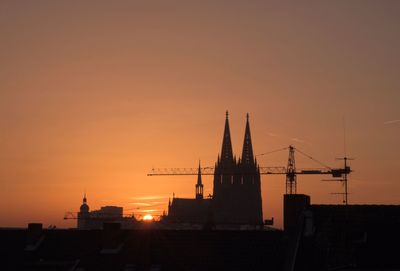 Silhouette of city at sunset