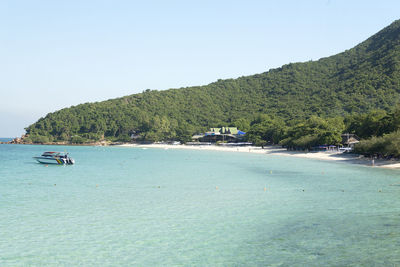 Scenic view of bay against clear sky