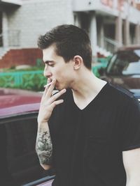 Man smoking cigarette outdoors