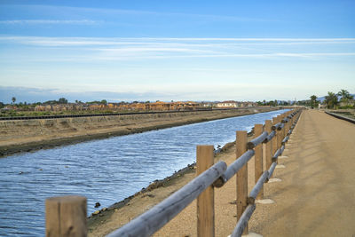 Scenic view of canal against sky