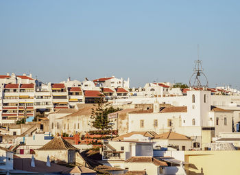 Townscape against clear blue sky