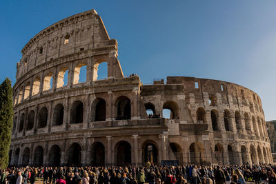 Group of people in front of historical building