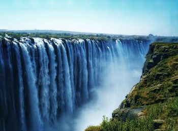 Panoramic view of the victoria waterfall against sky in zimbabwe 