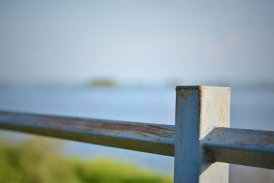 Close-up of wooden fence against sky