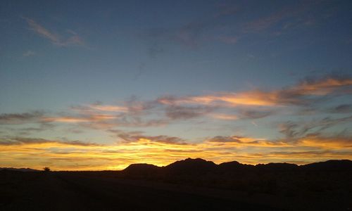 Scenic view of mountains at sunset