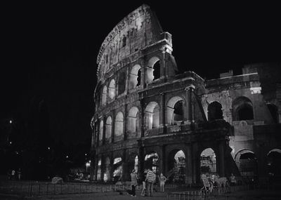 Low angle view of historic building at night