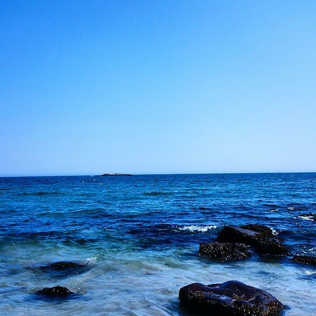 sea, water, clear sky, copy space, horizon over water, blue, scenics, tranquil scene, beauty in nature, tranquility, nature, waterfront, wave, rippled, seascape, idyllic, rock - object, day, no people, outdoors