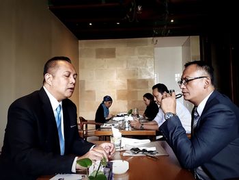 Friends working on table