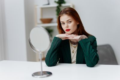 Portrait of young woman drinking glass