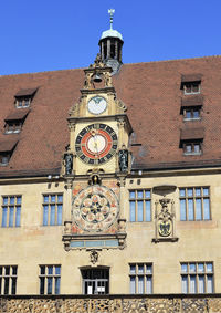 Low angle view of clock tower against sky