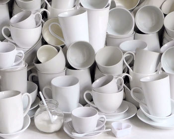 High angle view of white coffee cup collection 
