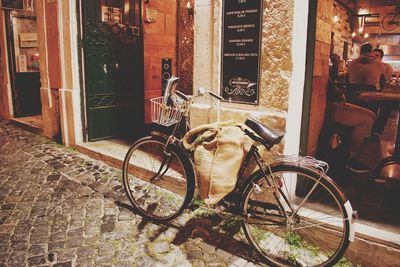 Bicycle on street against buildings