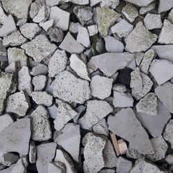 High angle view of stones on stone wall