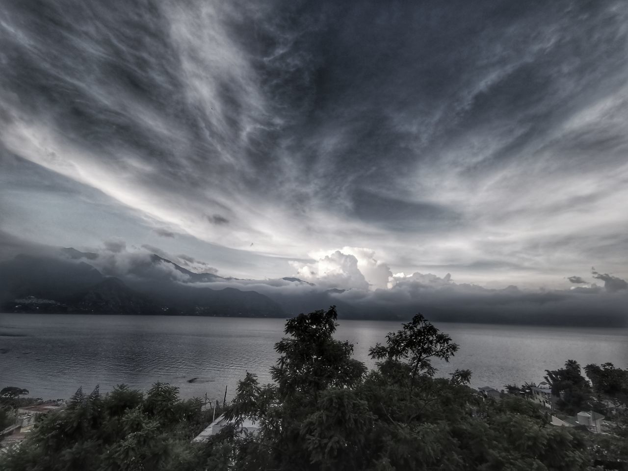 sky, cloud, water, beauty in nature, scenics - nature, tree, nature, environment, horizon, plant, sea, landscape, no people, darkness, tranquility, land, dramatic sky, black and white, storm, tranquil scene, cloudscape, outdoors, mountain, dusk, monochrome, beach, storm cloud, travel destinations, thunderstorm