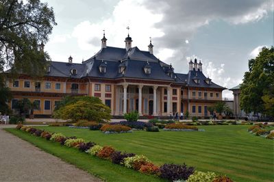 Park and buildings against sky