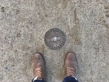 Low section of man standing on floor