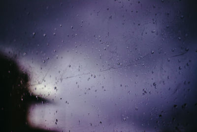 Full frame shot of raindrops on glass window