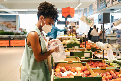 Woman standing at market stall