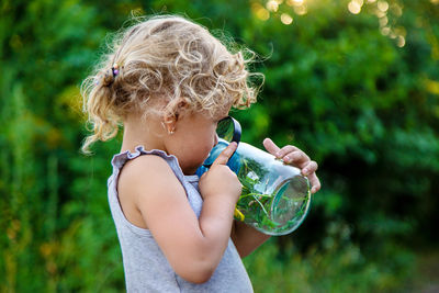 Young woman blowing bubbles