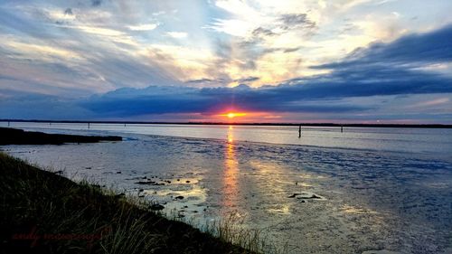 Scenic view of sea at sunset