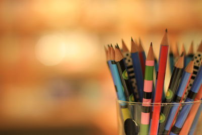 Close-up of colorful pencils in desk organizer