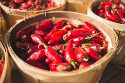 Close-up of red chili peppers in basket