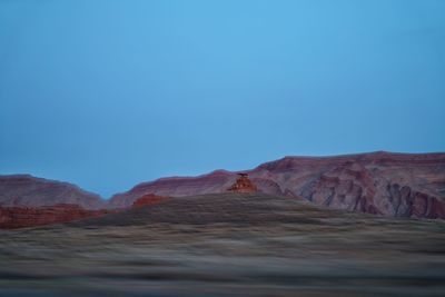 View of mexican hat rock formation against clear blue sky