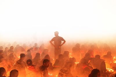 Man standing inside croud in rakher upobash