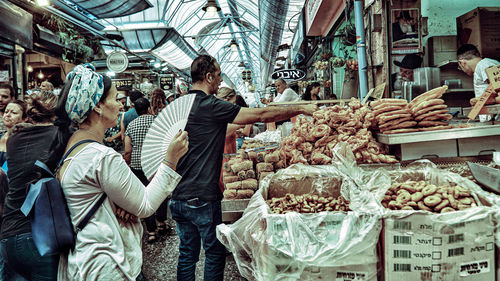 People at market stall