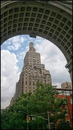 Building against cloudy sky