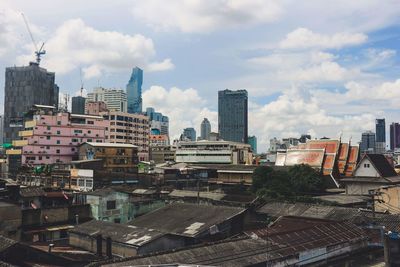 High angle view of buildings in city against sky