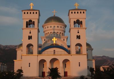 Low angle view of bell tower against sky