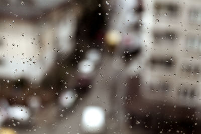 Full frame shot of raindrops on glass window