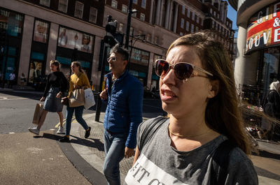 Portrait of people on street in city