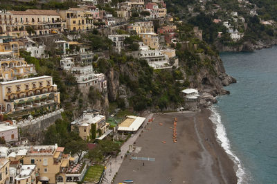 High angle view of townscape by sea