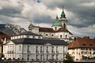 Buildings in city against sky