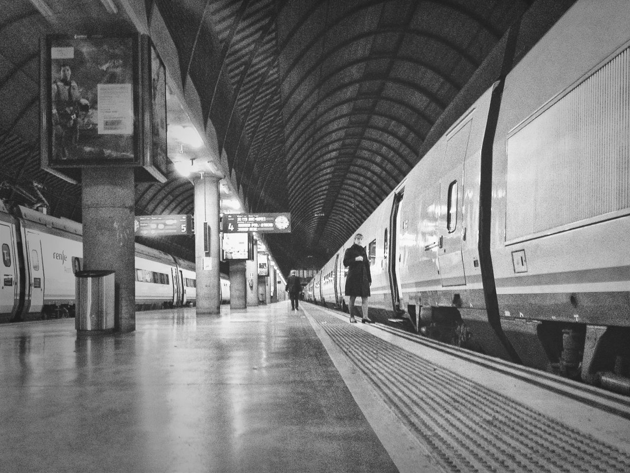 architecture, indoors, built structure, transportation, railroad station, ceiling, public transportation, railroad station platform, the way forward, architectural column, illuminated, empty, rail transportation, interior, train - vehicle, travel, connection, incidental people, subway station, diminishing perspective