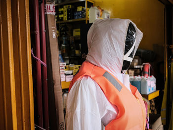 Rear view of woman standing in store