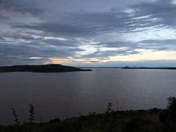 Scenic view of sea against cloudy sky