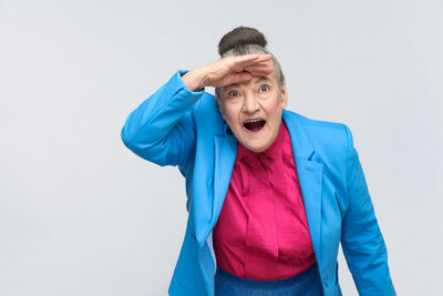 Portrait of mid adult man against white background