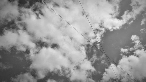 Low angle view of cables against sky