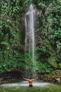 Full length of man against waterfall
