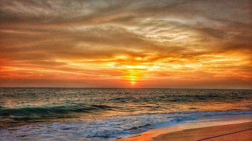 Scenic view of sea against sky during sunset