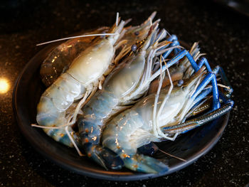 High angle view of fish in plate on table