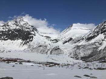 Scenic view of snowcapped mountains against sky