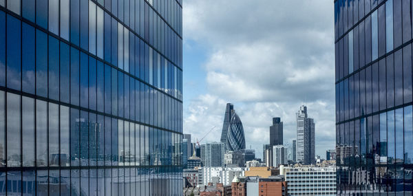 Modern buildings against sky in city